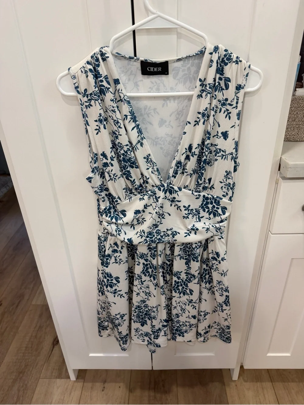 Cider White Romper with Navy Blue Floral Pattern - Picture 1 of 5